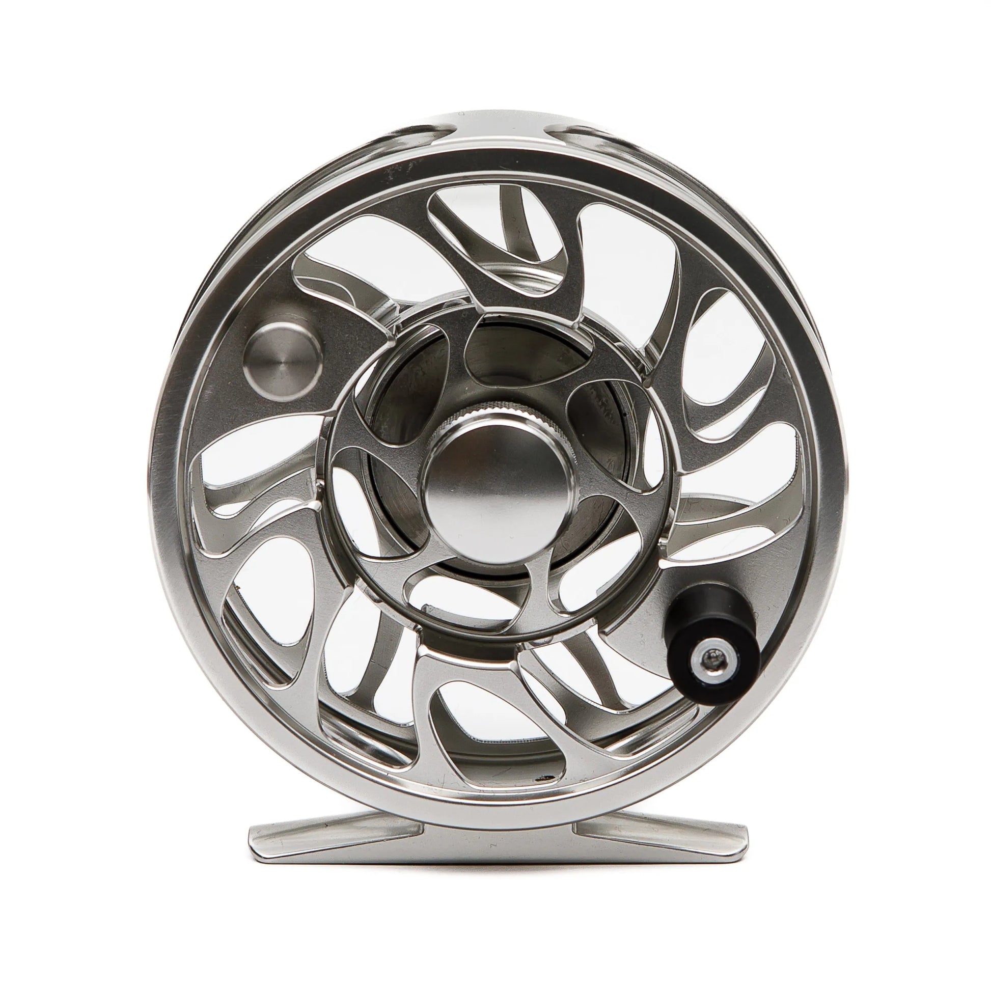 A silver Yellowstone Grizzly Fly Reel with Sealed Drag by Jackson Hole Fly Company stands upright on a white background, showcasing its CNC-machined aluminum body, modern openwork design, and central handle for a sleek, lightweight look.
