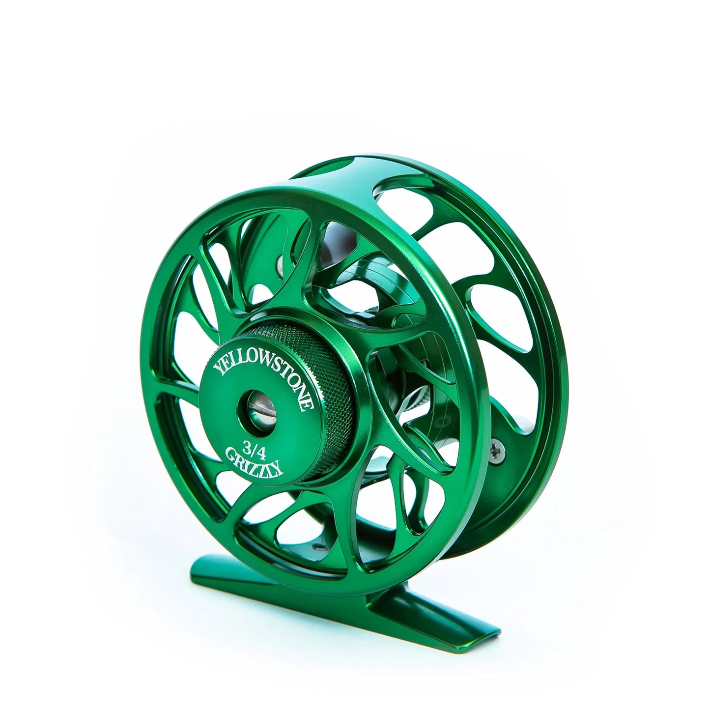 A green Yellowstone Grizzly Fly Reel with Sealed Drag by Jackson Hole Fly Company, engraved with Yellowstone 3/4 Gritti at the center, is displayed against a white background.