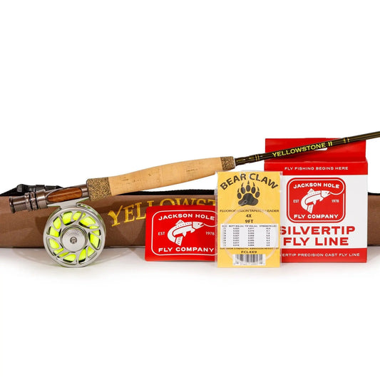 The Battenkill River Rod Combo Kit – 70 3WT from Jackson Hole Fly Company includes a fly rod, lightweight reel with yellow line, brown case, Bear Claw leader packaging, and red boxes of Silvertip Fly Line and accessories.