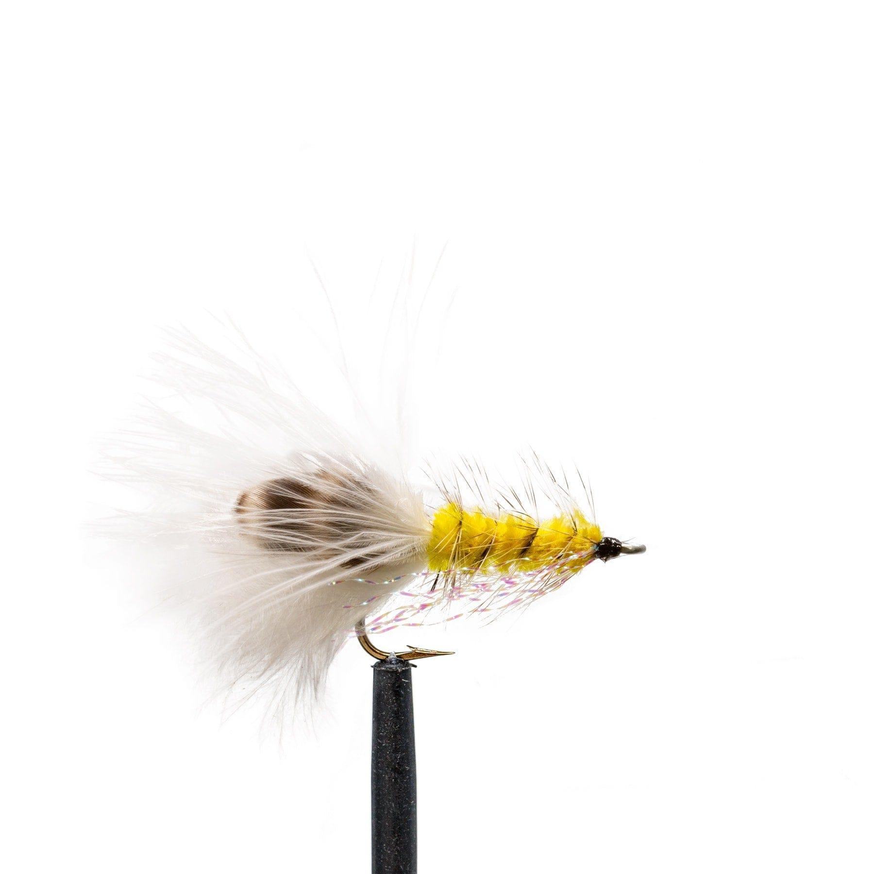 A close-up of a yellow saltwater fly with white feathers and a speckled pattern, mounted on a black hook and set against white, from the Jackson Hole Fly Company JHFLYCO Bonefish Fly Box – preloaded, precision-ready, and built saltwater tough.
