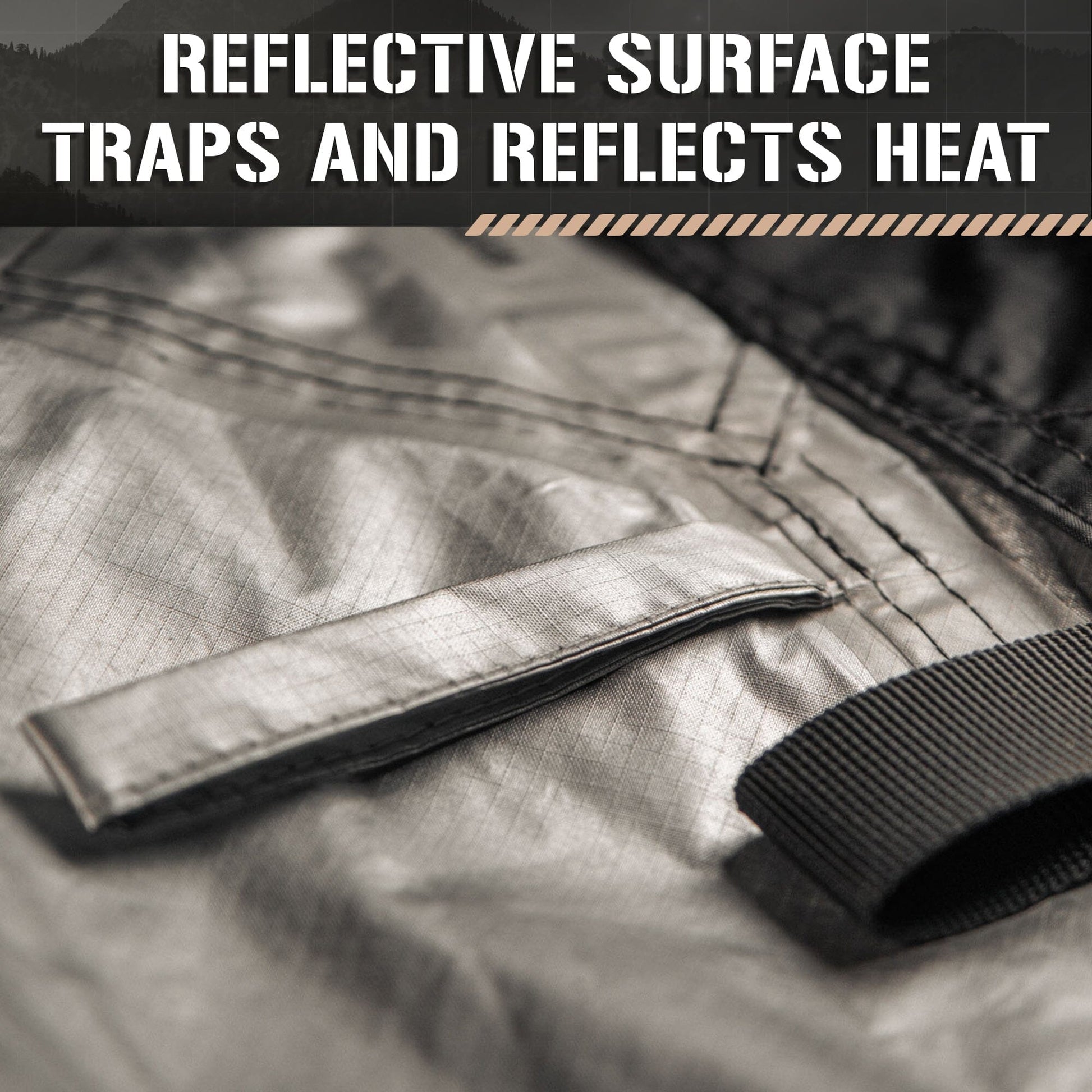 Close-up of the TACAMO® Bushcraft Reflective Shelter Tarp by TITAN Survival, showing its silver reflective surface with stitched details and black straps. Overlaid text: Reflective Surface Traps and Reflects Heat.