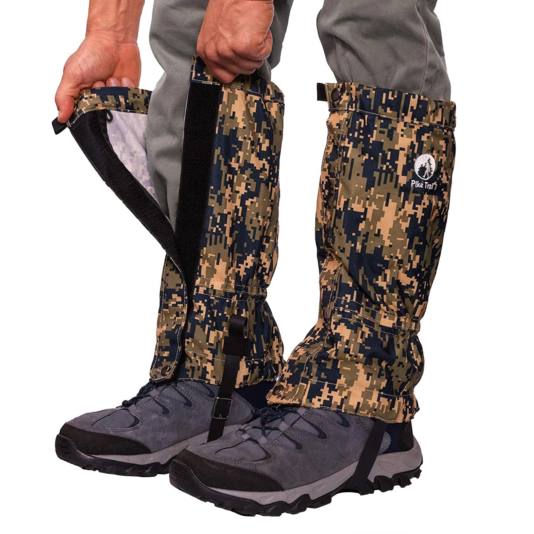 A person fastens Pike Trail All-Season Waterproof Leg Gaiters with a digital camo design over gray hiking boots and pants using Velcro strips, ensuring abrasion-resistant protection for any adventure on the trail, hunt, and beyond.