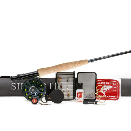 The Jackson Hole Fly Company Granite Creek Fly Fishing Combo Kit – 70 4WT Beginner Setup includes a rod, reel, fly box with assorted flies, nippers, line cleaner, floatant, hemostat, leader, and a red case—all on a white background.