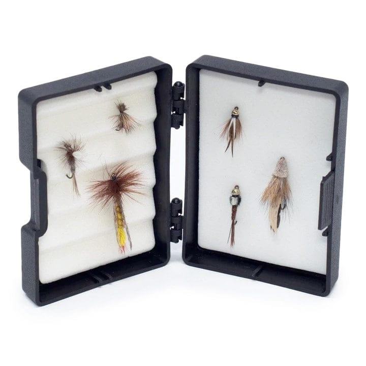 The Granite Creek Fly Fishing Combo Kit – 70 4WT Beginner Setup by Jackson Hole Fly Company includes six colorful flies arranged in an open black box on white foam—an ideal choice for those new to fly fishing.