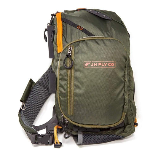 The JHFLYCO 13L Adjustable Sling Pack by Jackson Hole Fly Company features olive green color, black and orange accents, multiple zippered pockets, mesh straps, and a front logo patch—ideal as a water-resistant fishing bag for anglers on the go.