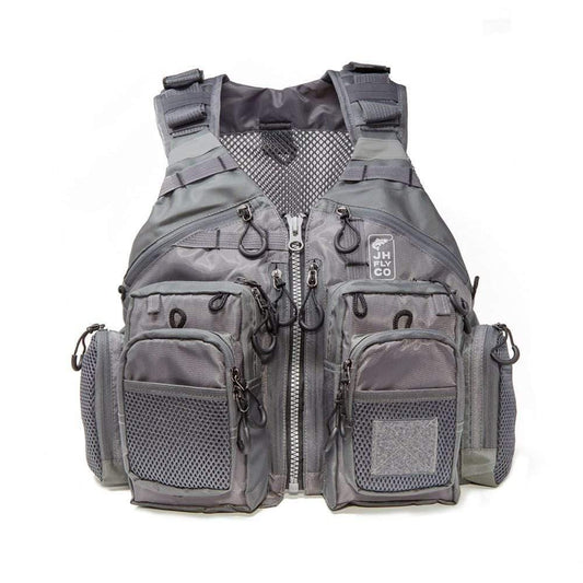 The JHFLYCO Adjustable Mesh Fishing Vest by Jackson Hole Fly Company features a gray design, multiple zippered pockets, breathable mesh panels, adjustable straps, various attachment loops, and a JH Co logo patch on the front.