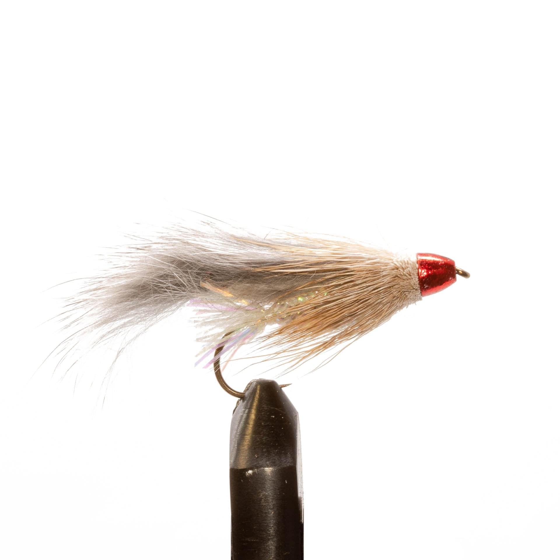 The JHFLYCO Loaded Foam Fly Box by Jackson Hole Fly Company features 10 large streamer flies, including a gray and tan fur lure with a shiny red head and iridescent strands, shown upright in a vise against a white background.
