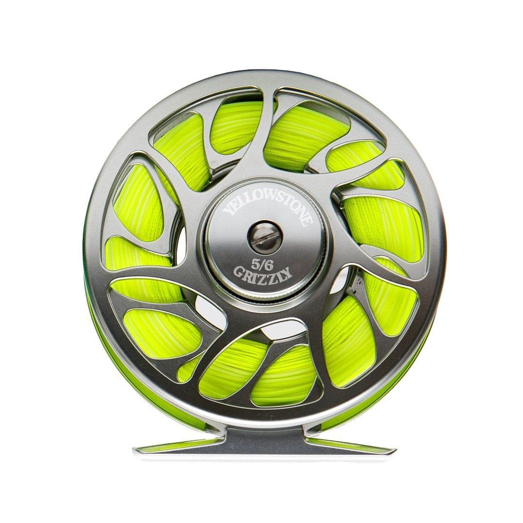 A bright yellow-green line is wound inside a metallic 6WT fly reel, labeled “Jackson Hole Fly Company,” featured in the Miracle Mile Rod Combo Kit – 90 6WT: Where Precision Meets Power—ideal for your next fly fishing adventure.