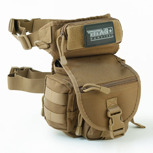 The TACAMO® 10L Tactical Drop Leg Bag by TITAN Survival is a tan, rugged 1000D Cordura nylon thigh pack with multiple compartments, MOLLE webbing, clips, an adjustable strap, and a front flap featuring a TITAN Survival patch.